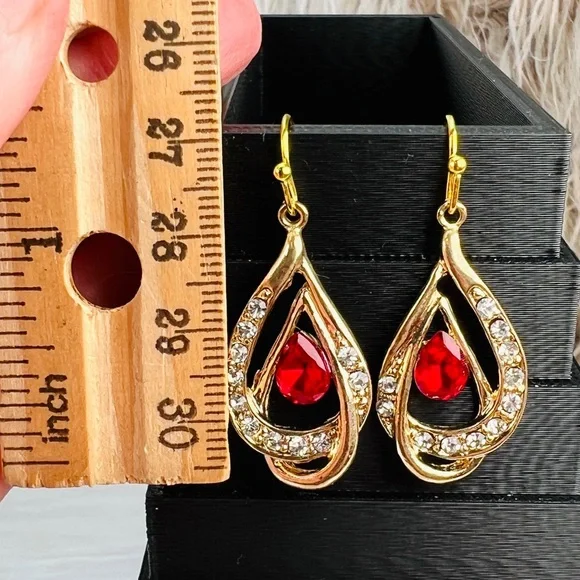 Pretty aged goldtone red and clear bling accent pierced earrings